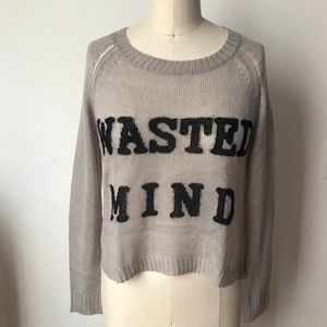 Light grey sweater with open cross-over back